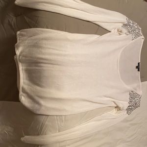 Express sweater s with embellishments